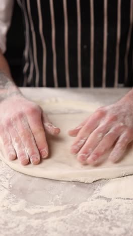 chef making pizza dough