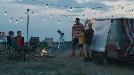 family camping trip at dusk
