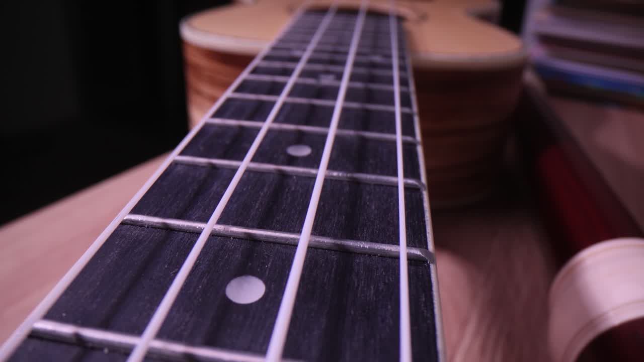Close-up of a ukulele's fretboard
