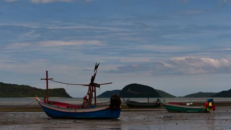 Fishing-Boats-mooring-in-low-tide-are-usually-seen-as-part-of-a-romantic-provincial-seascape-of-Khao-Sam-Roi-Yot-National-Park,-Prachuap-Khiri-Khan,-in-Thailand