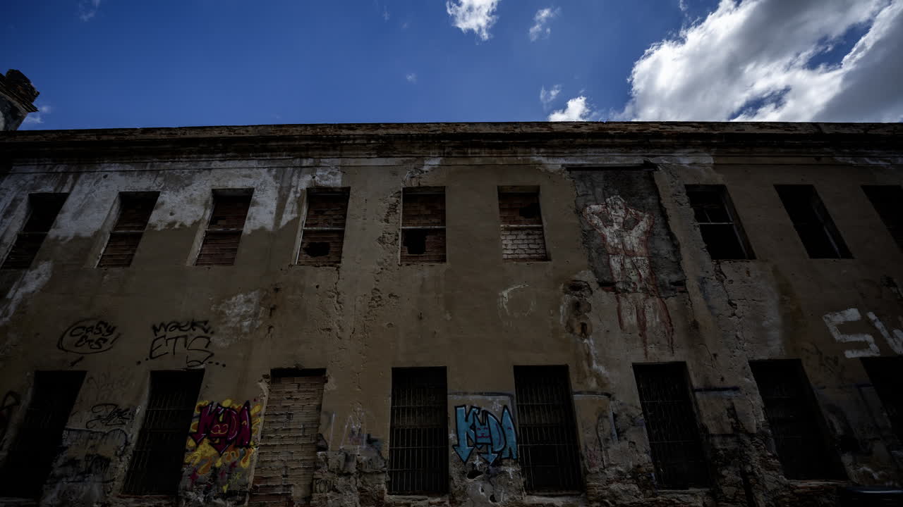 Old factory and industrial complex with passing clouds