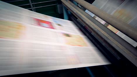 close-up newspaper printing equipment. printing machine with newspaper in print house.