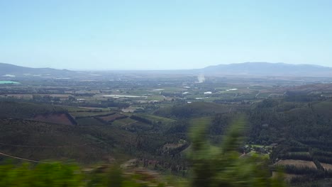 Traveling-over-a-mountain-pass-looking-down-on-the-city-below