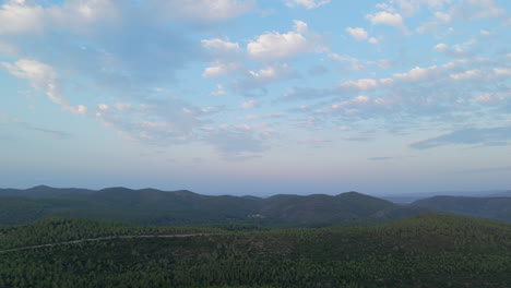 aerial footage: drone captures majestic mountain valley at golden hour sunrise