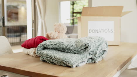 donating cozy blankets and toys at home for christmas charity