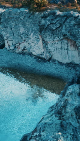 aerial view of a river running through a mountain canyon