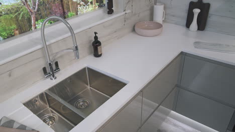 slow camera pan of a white and grey modern kitchen