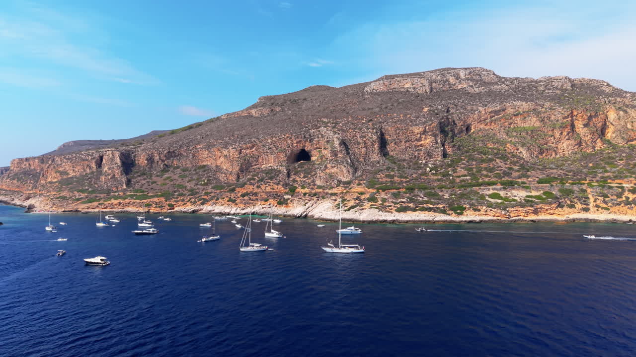 Boats in the Mediterranean Sea near cliffs