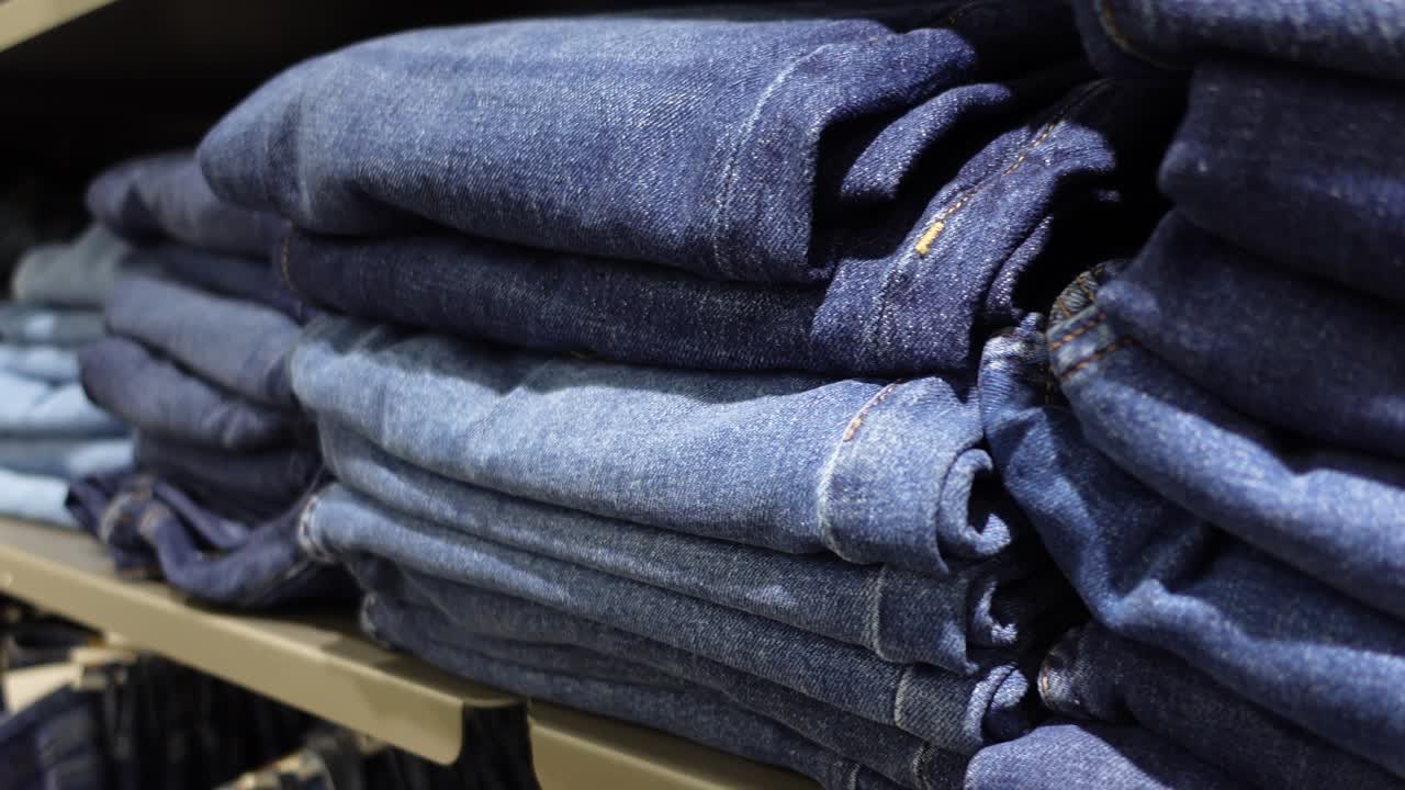 Stacked Blue Jeans on Shelves