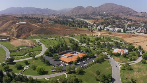 aerial wide panning shot of a mortuary in california