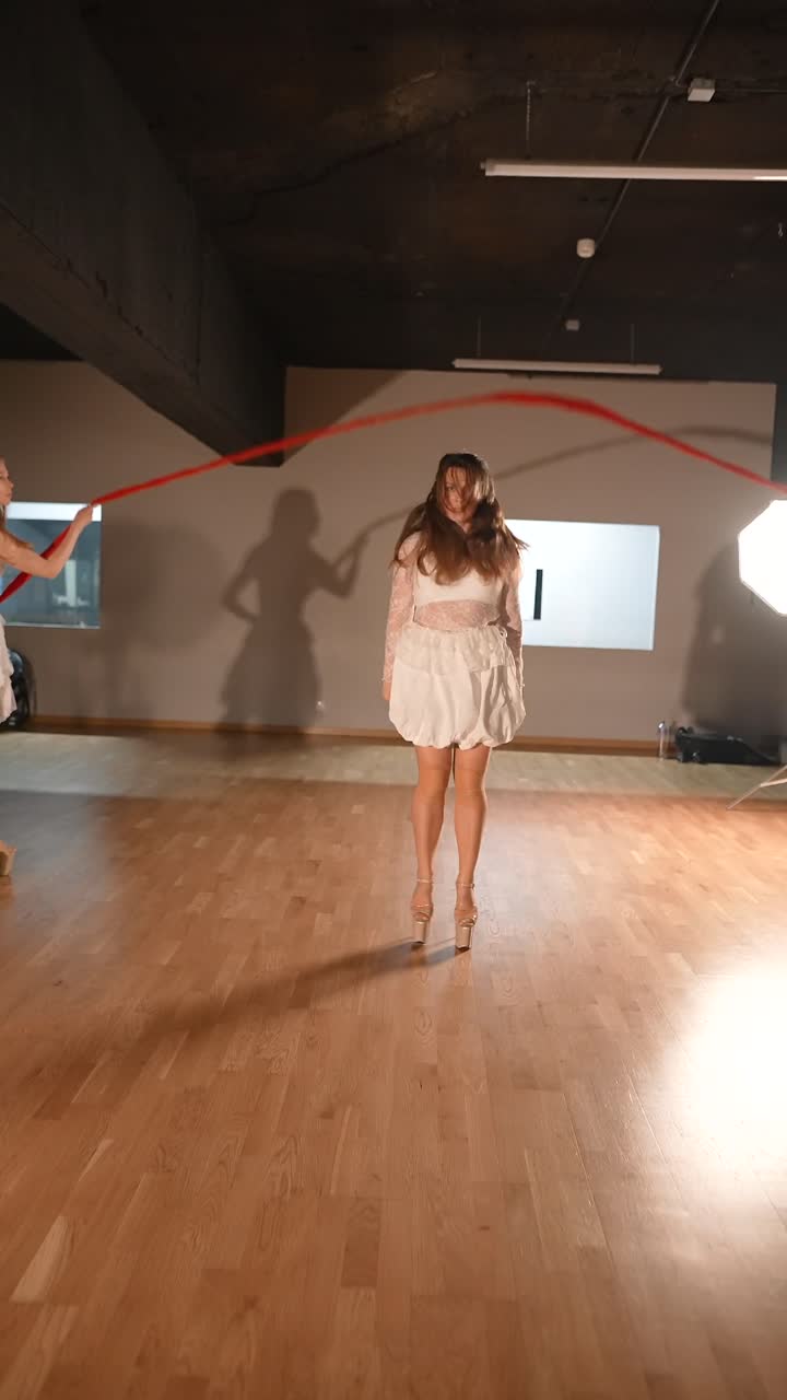 Woman in motion performing contemporary dance in a studio