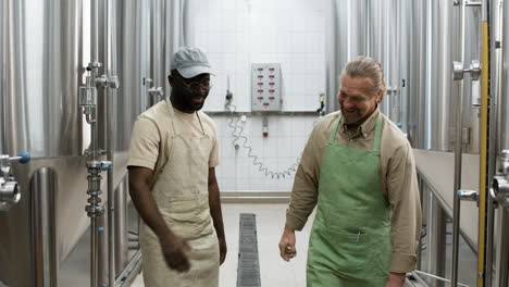 two men talking in the factory