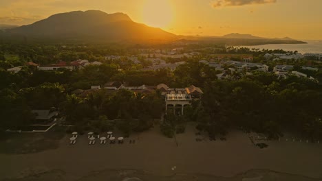 golden hour sunset over pristine white sand beach in puerto plata