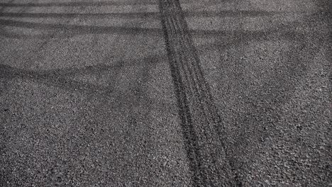 drift marks on an asphalt from drift tires, slow motion fly by