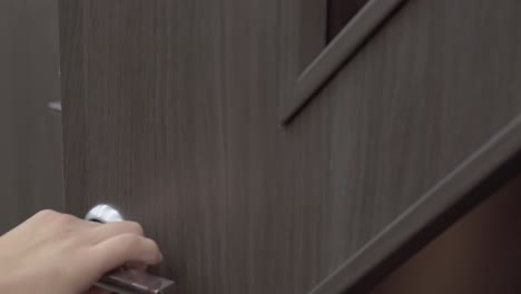 young guy chooses doors in a building materials store