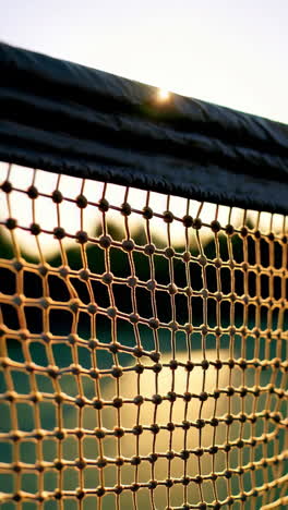 close-up of a sports net at sunset