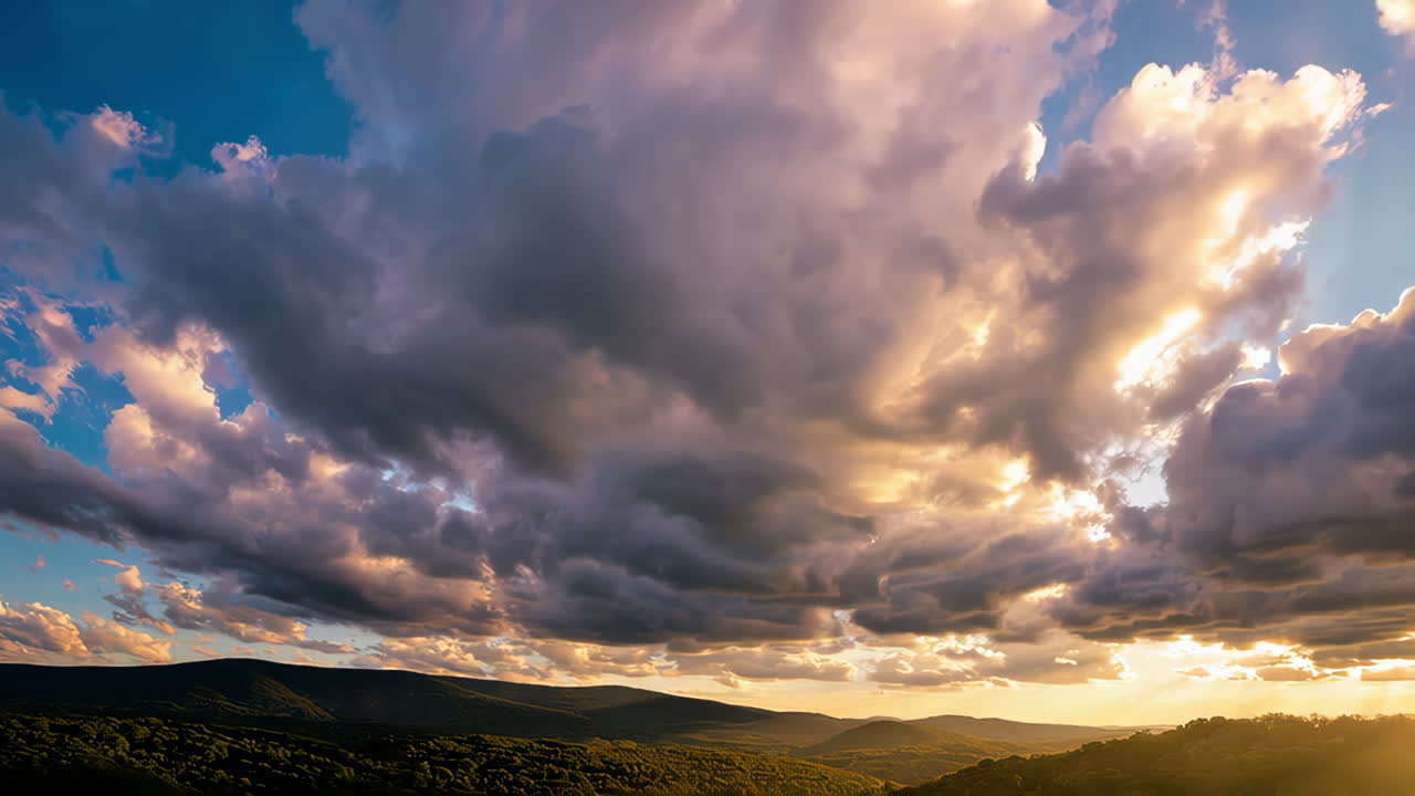 Sunset over Mountain Range with Dramatic Cloudscape