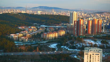 aerial view of a city with residential buildings and snow