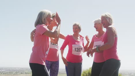 Athletics-women-hugging-each-other--