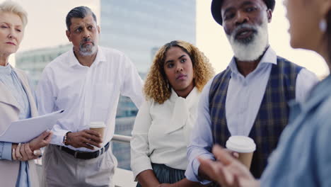 Teamwork,-meeting-and-business-people-on-rooftop