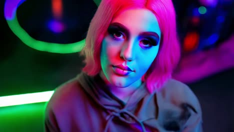 neon portrait of a woman with pink hair and bold makeup