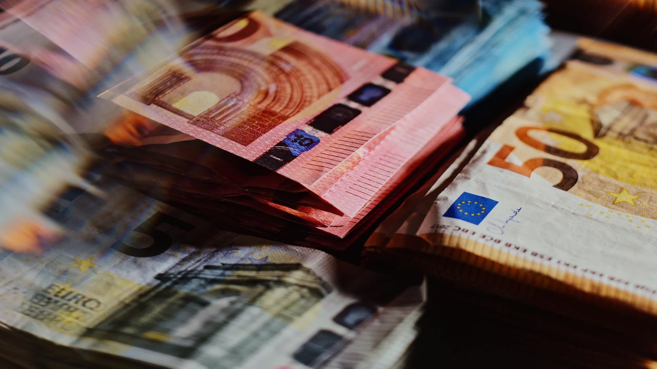 Artistic euro banknotes captured with glass blur and motion light effects
