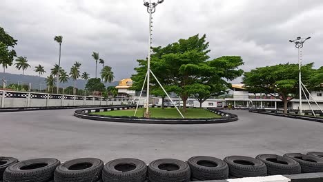 empty go-kart track with lush surroundings