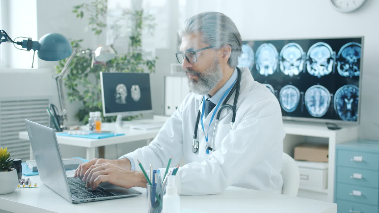 Doctor working on laptop in a medical office