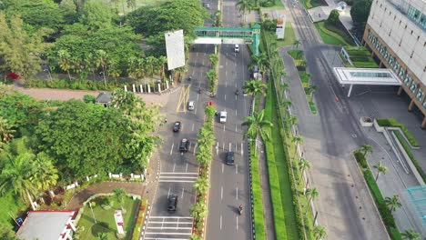 aerial view of a city street with traffic and urban landscape