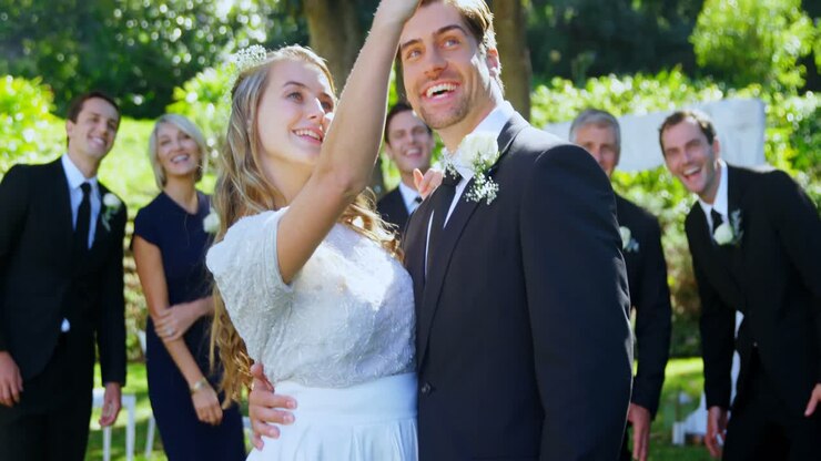 Happy young bride and groom taking selfie with family 4K 4k