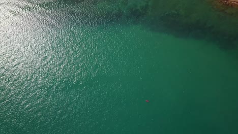 Overhead-view-of-a-kayaker-paddling-of-the-coast-of-Thailand