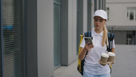 woman delivering coffee in the city