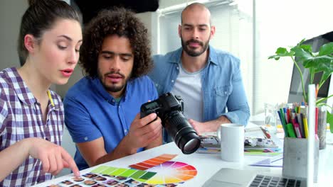 male and female graphic designers interacting with each other