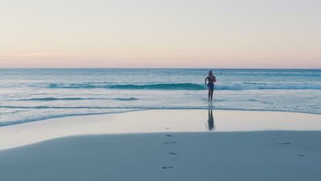 Woman,-running-and-ocean-with-waves