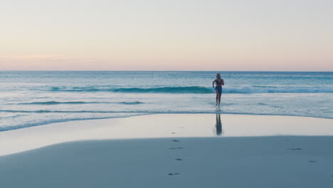 woman, running and ocean with waves