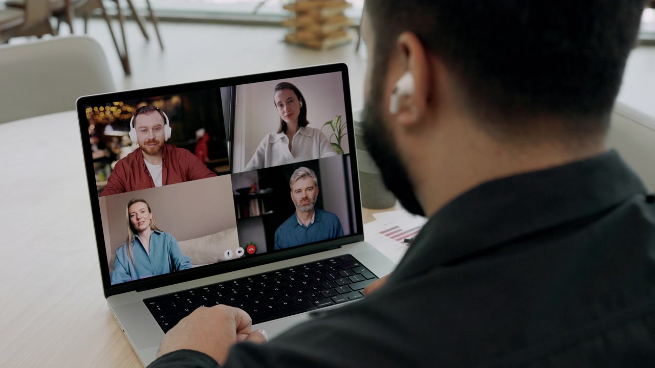 Man Participating in a Video Conference Call on Laptop
