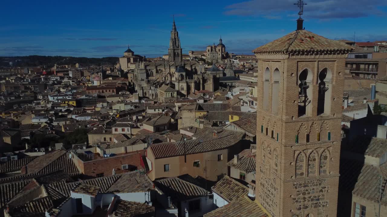 Cinematic drone video over Toledo with steeple of Catedral Primada rising to the sky - Toledo, Spain