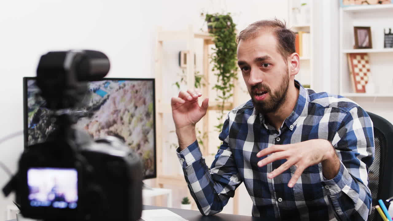 Man recording a vlog in his studio