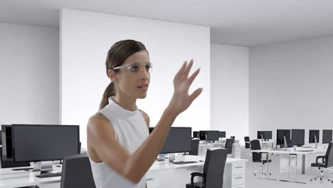 businesswoman wearing scientific glasses sliding a digital screen 4k