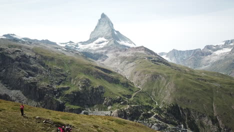 tilt up: drone view of the cervin, zermatt in the swiss alps, rocky and sharp summit, snowy mountain peak, drone aerial view, landscape