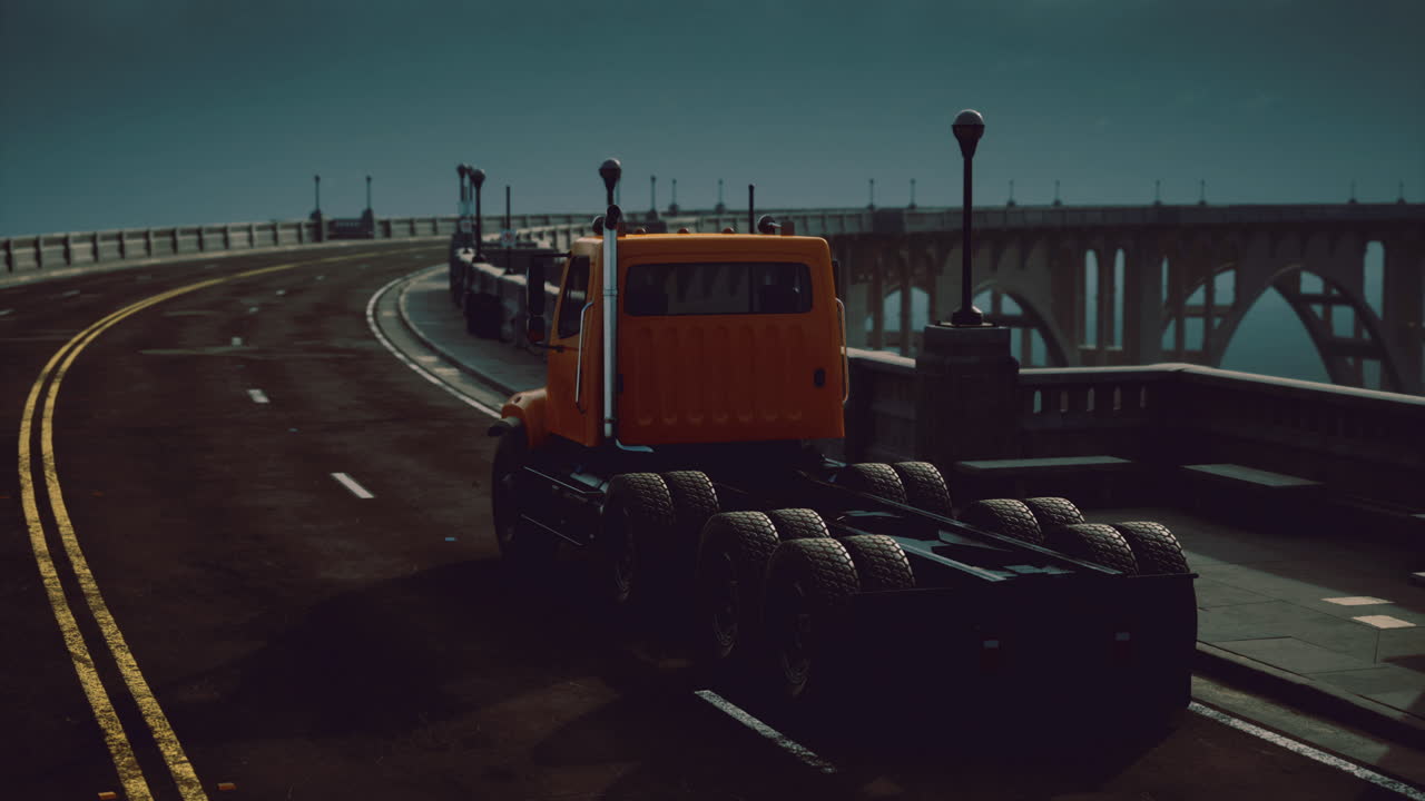 Truck travels along a winding road under moonlit skies near the bridge