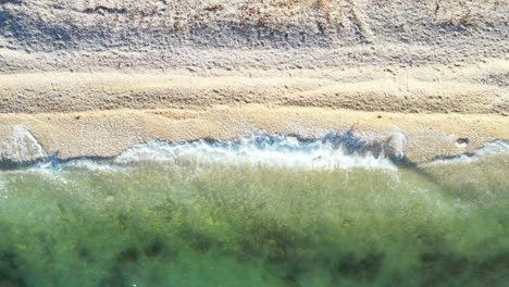 long sand beaches on adriatic sea in croatia, waves break on beautiful shore.