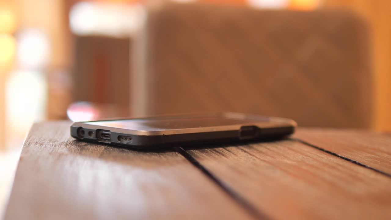 A smartphone on a wooden table