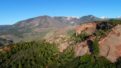 Flight-over-a-faint-trail-on-the-edge-of-Castle-Valley-near-Moab,-Utah