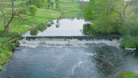 slowmotion aerial shot of a small dam