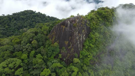 cinematic aerial view of jungle landscape and clouds above hills, highlands of guyana, south america