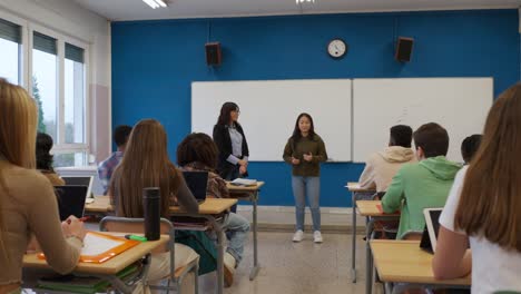Students in a Classroom Listening to a Presentation