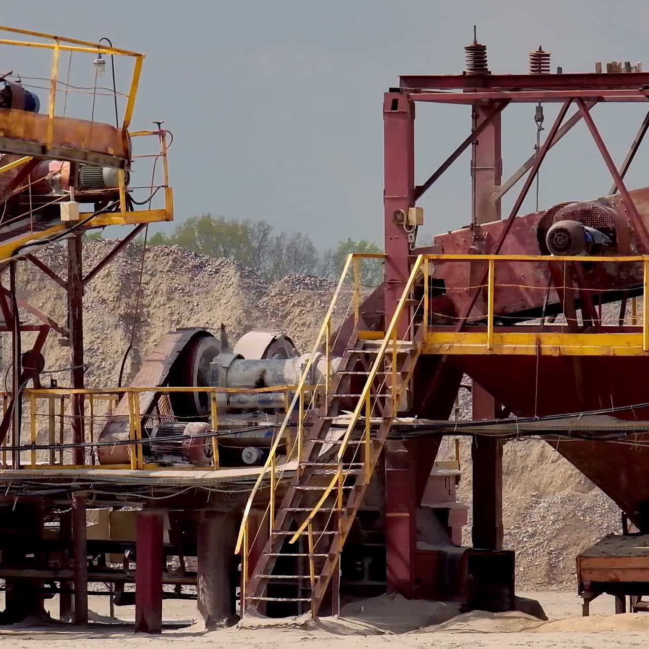 Stone crusher plant machine. Conveyor belt in work process. Transportation and separation of gravel pebbles. Quarry equipment for production of building materials.