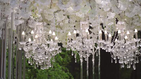 white wedding arch with chandeliers and candles 05