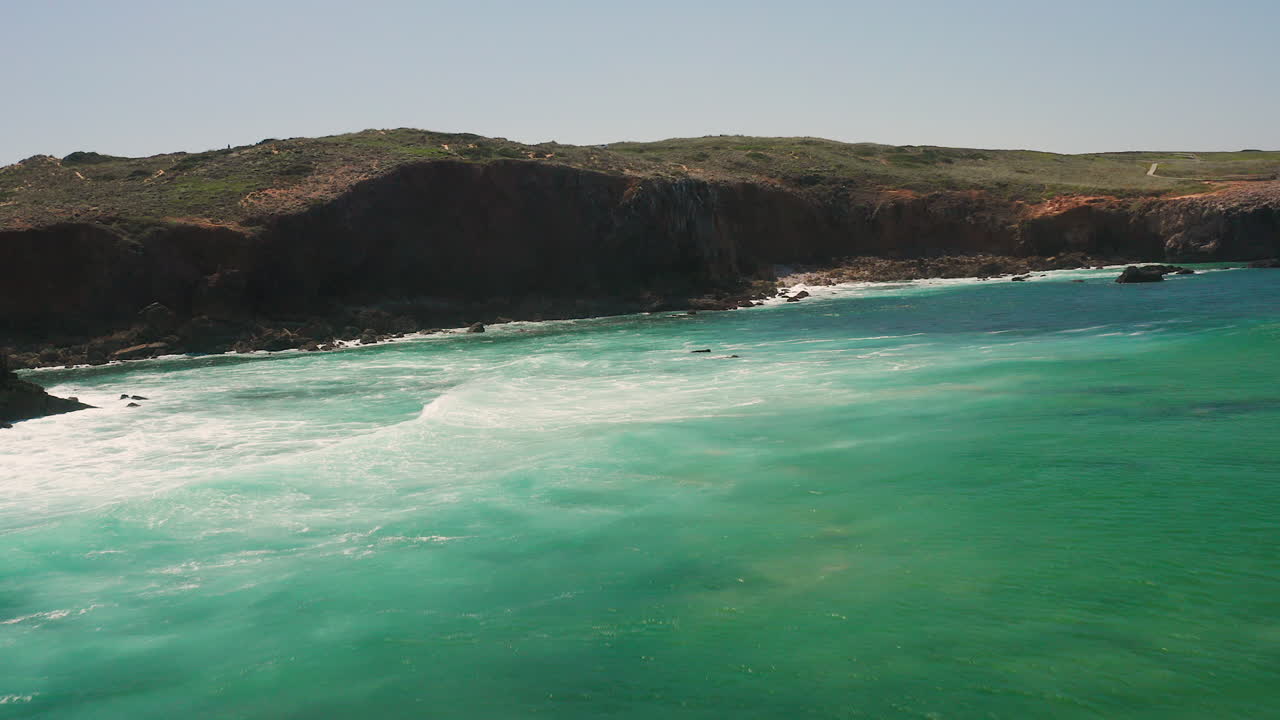 Aerial: The surf beach of Bordeira in the Algarve